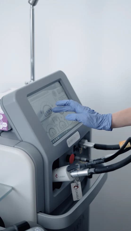 Touchscreen of a laser hair removal machine being operated.